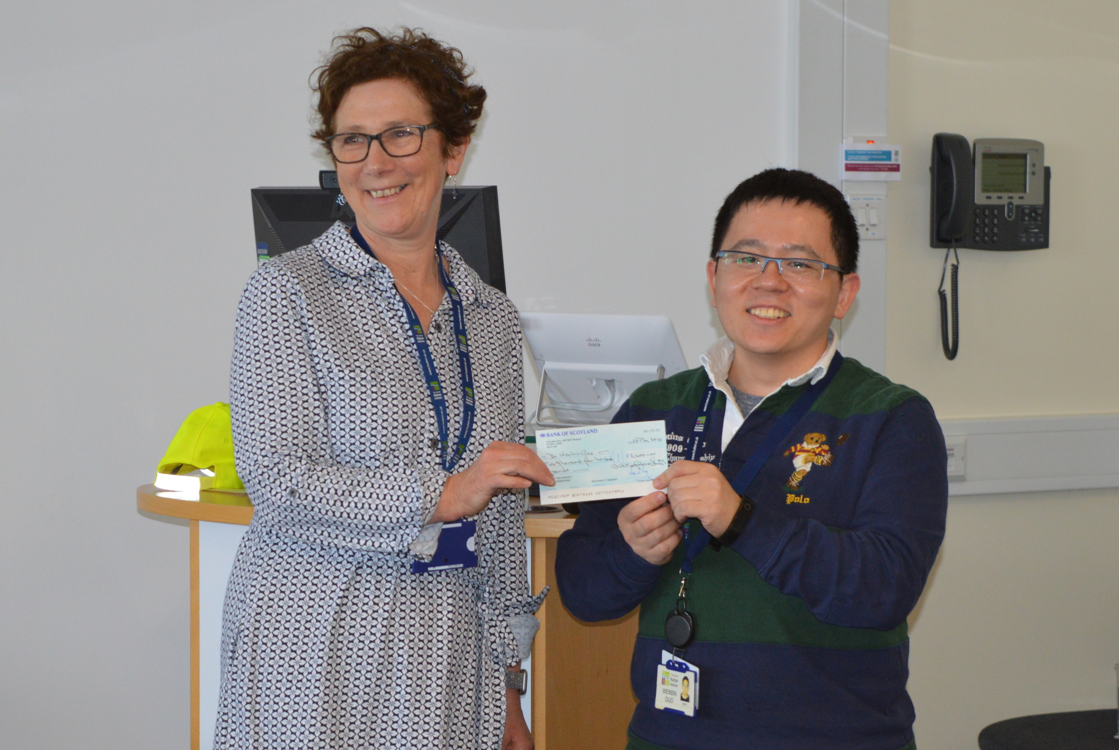 SSCR secretary Dr Joanne Russell hands the Massalski Prize to Dr Wenbin Guo